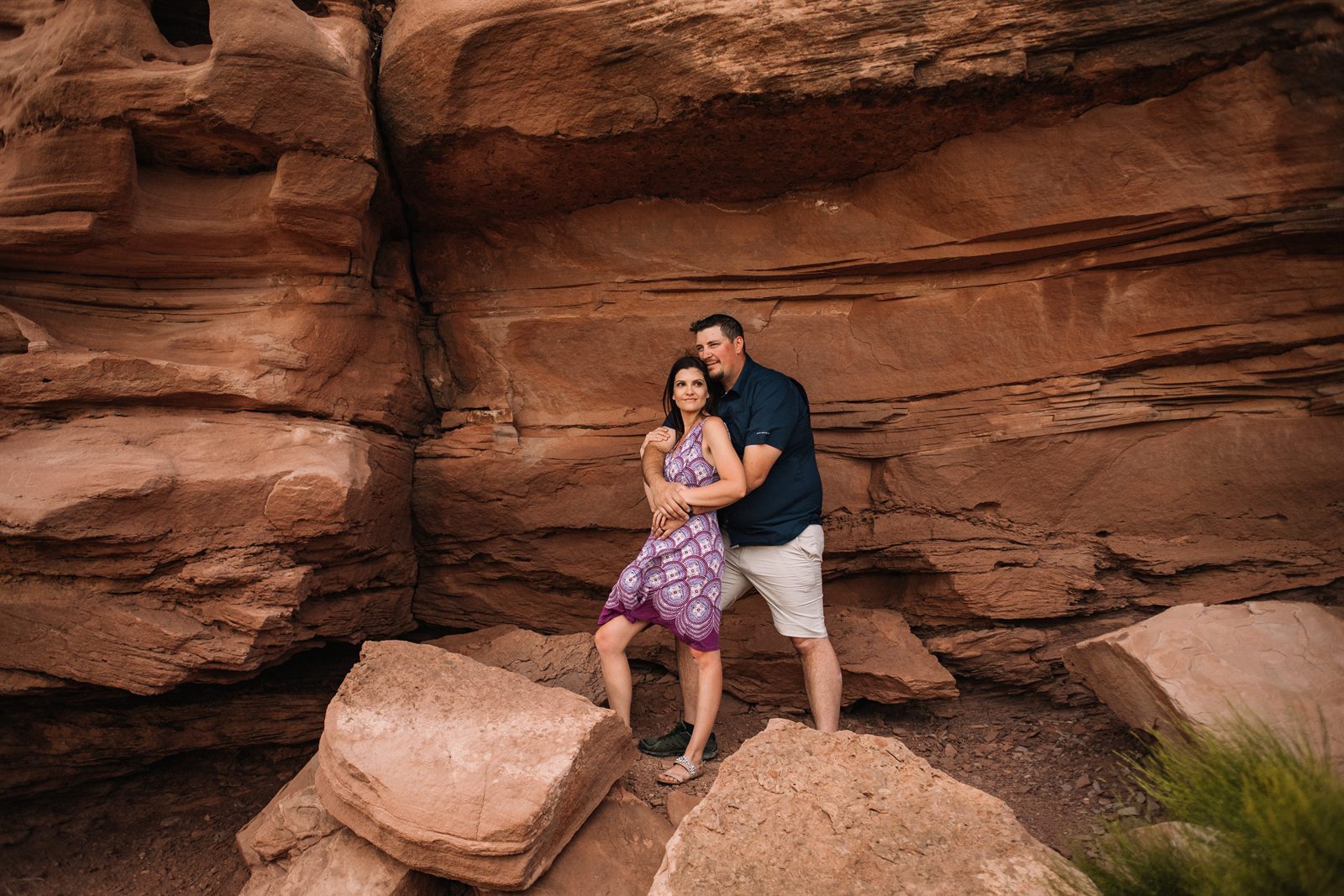 The couple among red rock canyons out West
